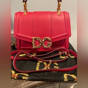 Well-structured and high on style, this DG Amore bag from Dolce & Gabbana.